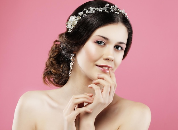 Beautiful model with bridal makeup and hairstyle