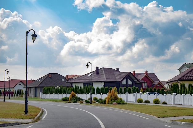 Beautiful and modern houses against the sky with clouds.