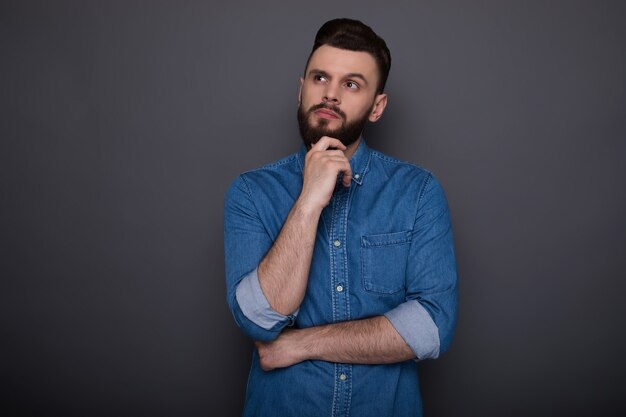 Beautiful modern smart confident man has some ideas while thinking process