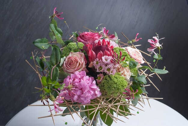 Beautiful modern wedding bouquet on white table. Selective focus