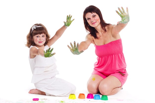 Beautiful mommy and her kid paintig a picture for kindergardern hobby education development child developing painting skills close up photo