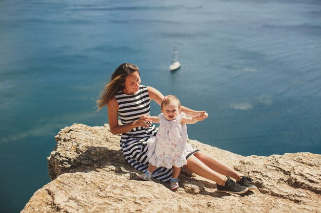 Beautiful mother and daughter on the mountain