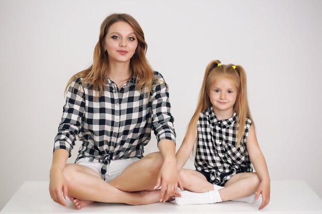 Beautiful mother and daughter with matching shirts