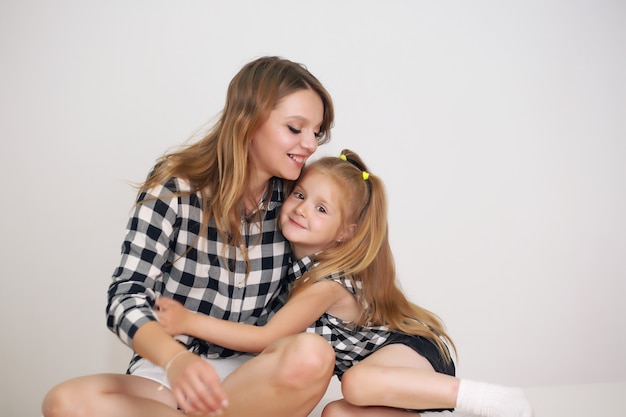 Beautiful mother and daughter with matching shirts