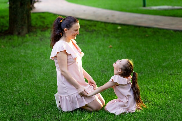 Beautiful mother with her daughter in the park