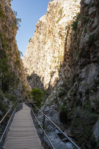 A beautiful mountain gorge with a river and a waterfall