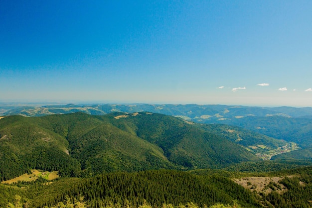 Beautiful mountain landscape with mountain peaks covered with forest and a cloudy sky Ukraine mountains Europe