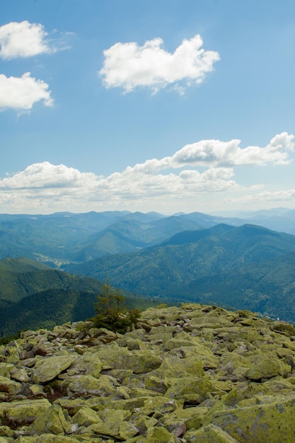 Beautiful mountain landscape with mountain peaks covered with forest and a cloudy sky Ukraine mountains Europe