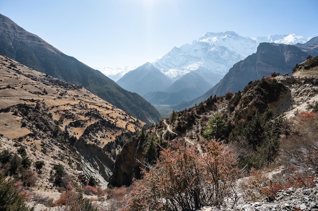 Beautiful mountain landscape with terraces rocks and snowy peaks in Nepal