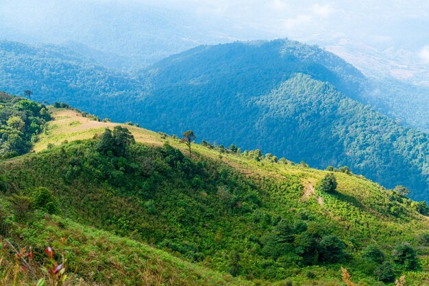 beautiful mountain layer with clouds and blue sky at  Kew Mae Pan Nature Trail in Chiang Mai, Thailand