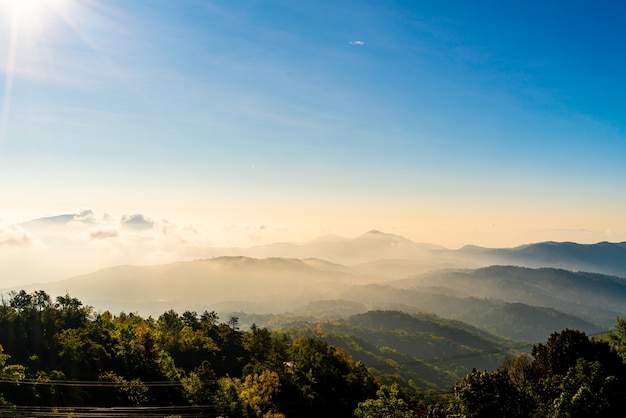 Beautiful mountain layer with clouds and sunrise at chiang mai in thailand