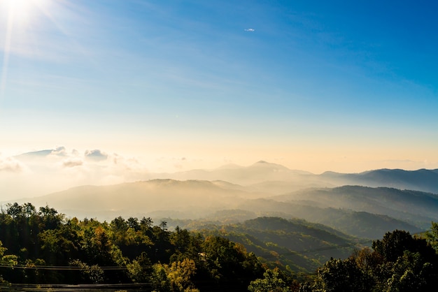 beautiful mountain layer with clouds and sunrise at Chiang Mai in Thailand