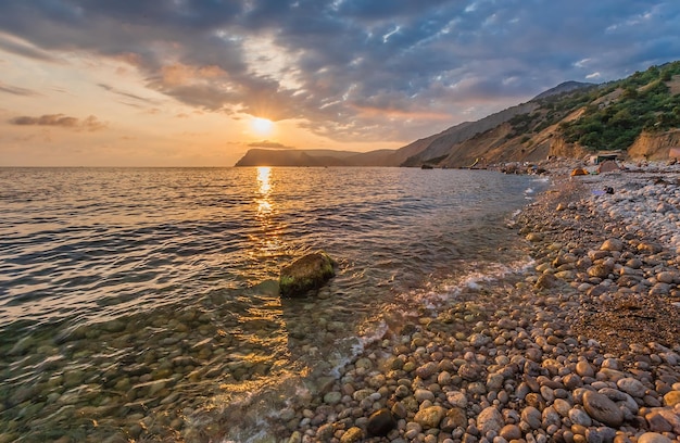 Beautiful mountain seaside at sunset