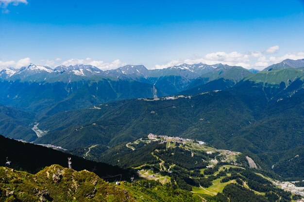 Beautiful mountains landscape green tops valleys and clouds in blue sky