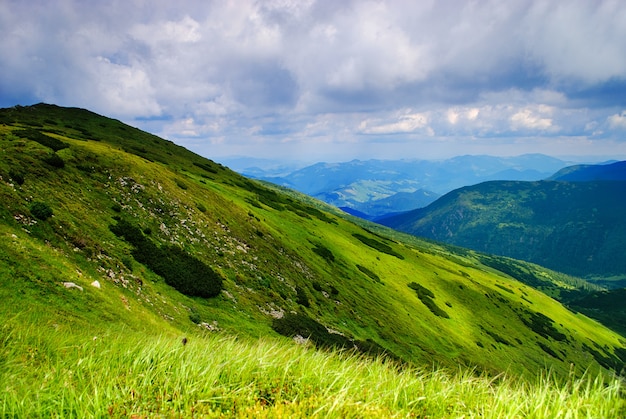 Beautiful mountains landscape with lake and clouds in Carpathian mountains