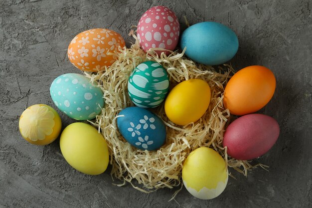 Beautiful multicolor Easter eggs on gray textured background