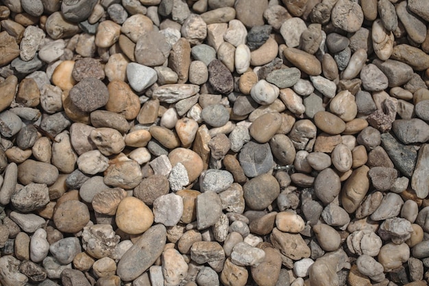 Beautiful multicolored pebbles on the sea rest