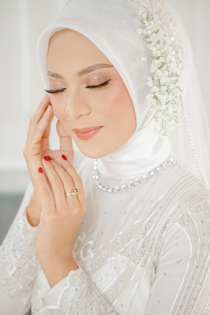 Beautiful muslim girl in hijab smiling