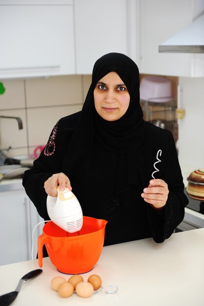 Beautiful muslim woman in the kitchen