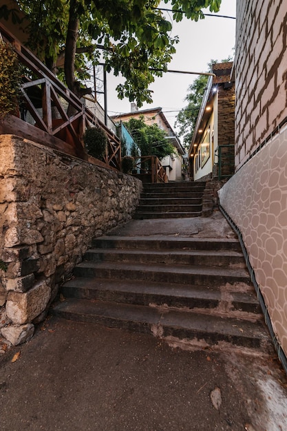 Beautiful narrow alley with stone trim and facades of buildings