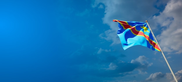 Beautiful national state flag of Congo on blue sky