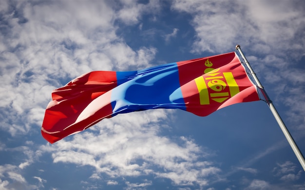 Beautiful national state flag of Mongolia fluttering on blue sky