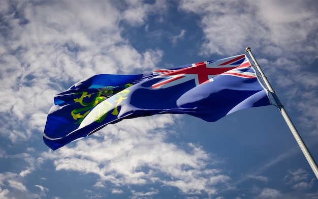 Beautiful national state flag of Pitcairn fluttering on blue sky