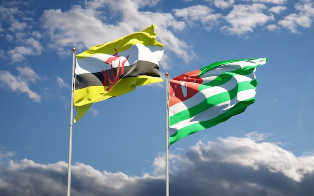 Photo beautiful national state flags of abkhazia and brunei together