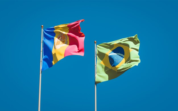 Beautiful national state flags of Brasil and Andorra together on blue sky