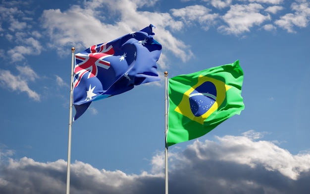 Beautiful national state flags of Brasil and Australia together on blue sky