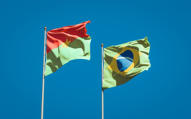 Beautiful national state flags of Brasil and Burkina Faso together on blue sky