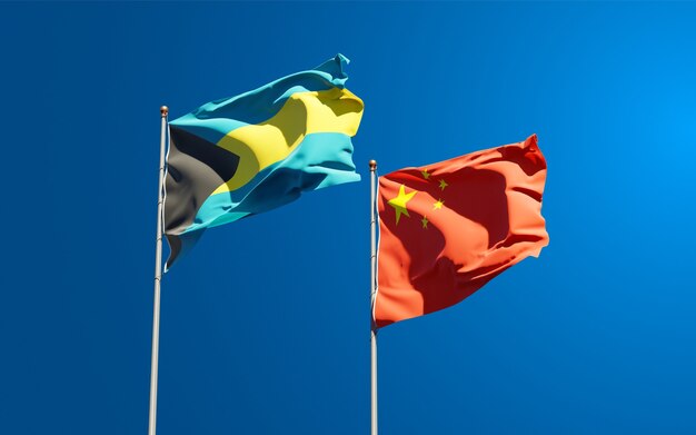 Beautiful national state flags of China and Bahamas together at the sky 