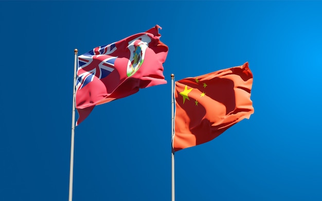 Beautiful national state flags of China and Bermuda together at the sky 