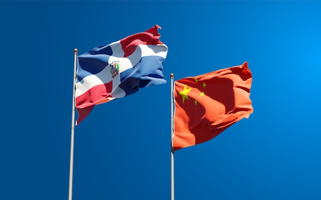 Beautiful national state flags of China and Dominican Republic together at the sky 