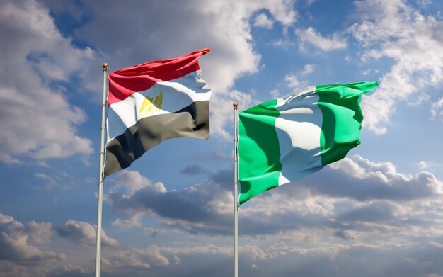 Beautiful national state flags of Egypt and Nigeria together on blue sky