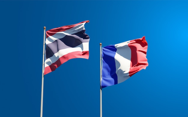 Beautiful national state flags of France and Thailand together at the sky 