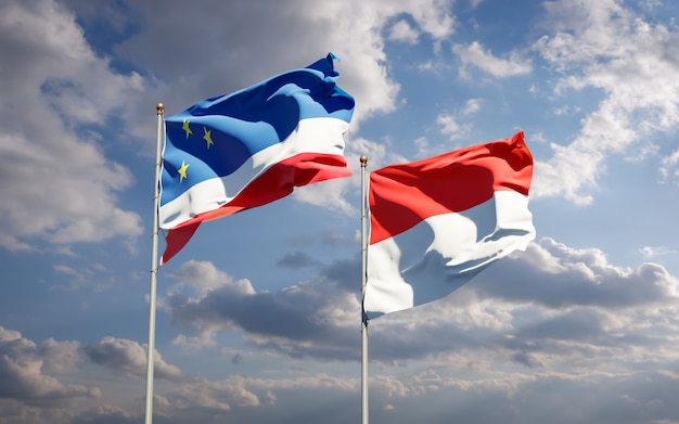 Beautiful national state flags of Gagauzia and Indonesia together on blue sky