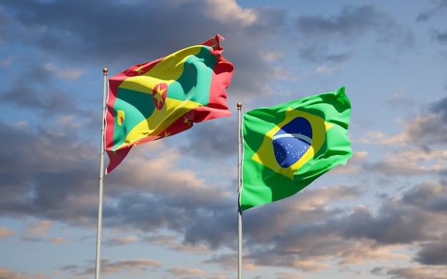 Beautiful national state flags of Grenada and Brasil together on blue sky