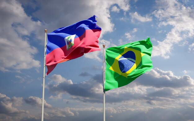 Beautiful national state flags of Haiti and Brasil together on blue sky