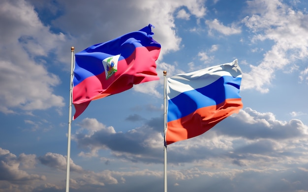 Beautiful national state flags of Haiti and Russia together on blue sky. 3D artwork