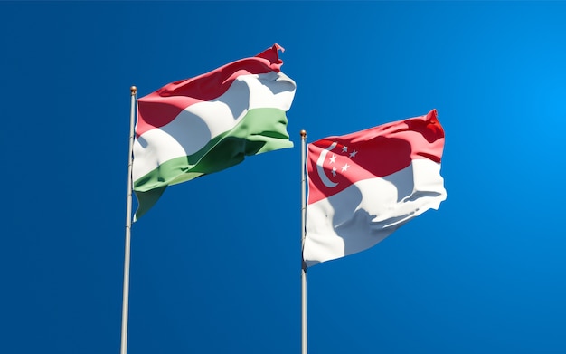 Beautiful national state flags of Hungary and Singapore together