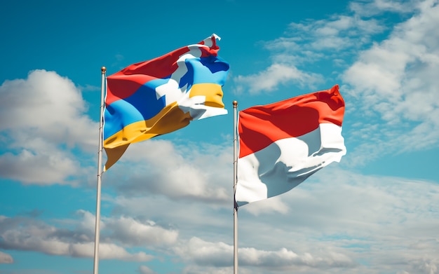 Beautiful national state flags of Indonesia and Artsakh together on blue sky