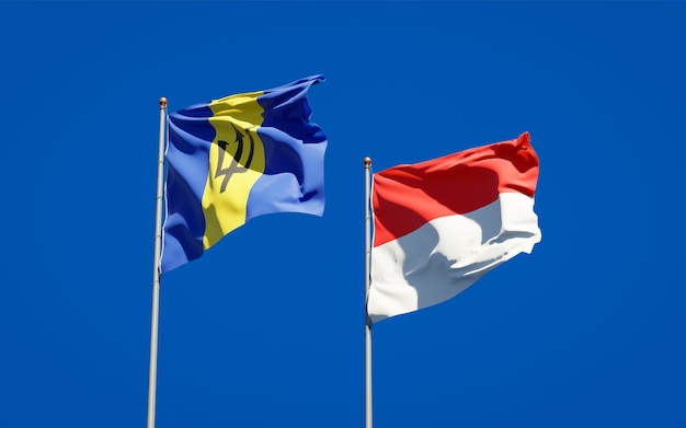 Beautiful national state flags of Indonesia and Barbados together on blue sky