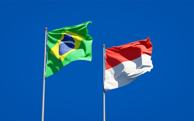 Beautiful national state flags of Indonesia and Brasil together on blue sky