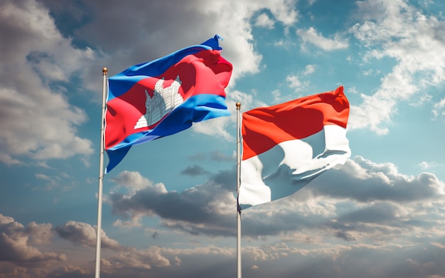 Beautiful national state flags of Indonesia and Cambodia together on blue sky