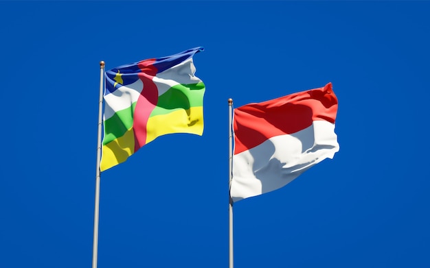 Beautiful national state flags of Indonesia and CAR Central African Republic together on blue sky