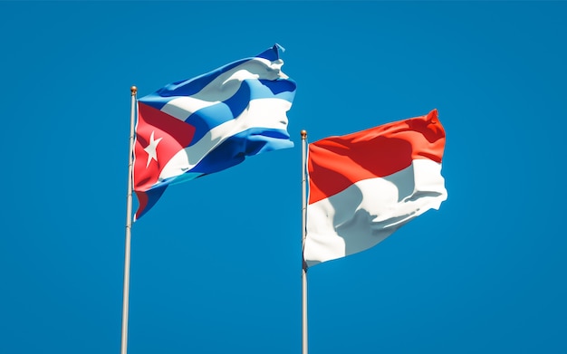 Beautiful national state flags of Indonesia and Cuba together on blue sky