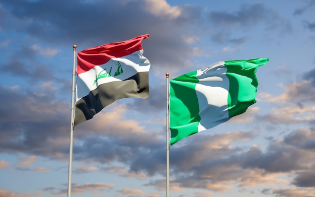 Beautiful national state flags of Iraq and Nigeria together on blue sky