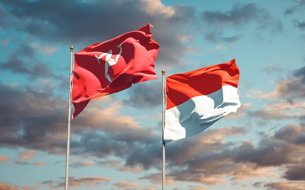 Beautiful national state flags of Isle of Mann and Indonesia together on blue sky