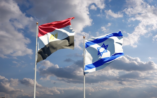 Beautiful national state flags of Israel and Egypt together at the sky background.